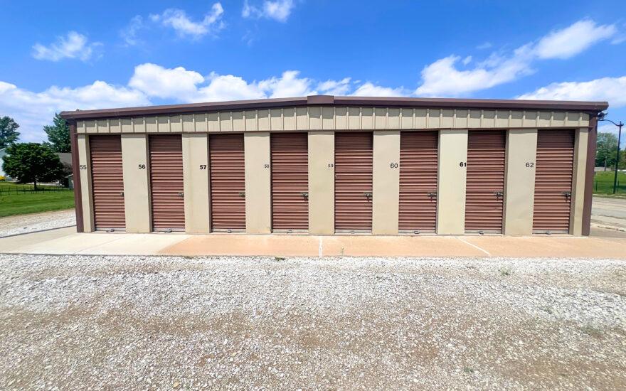 brown storage units with blue sky background