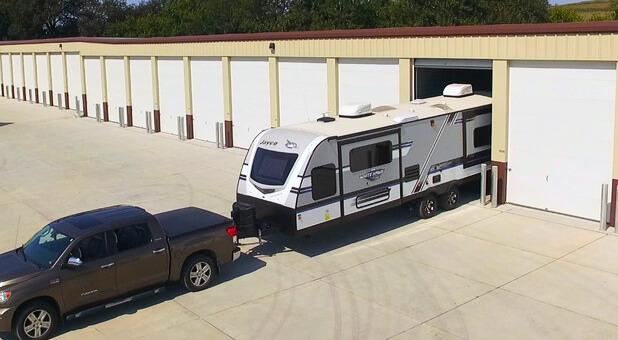 warehouse-space-omaha-ne vehicle backing in an RV into a contractor bay
